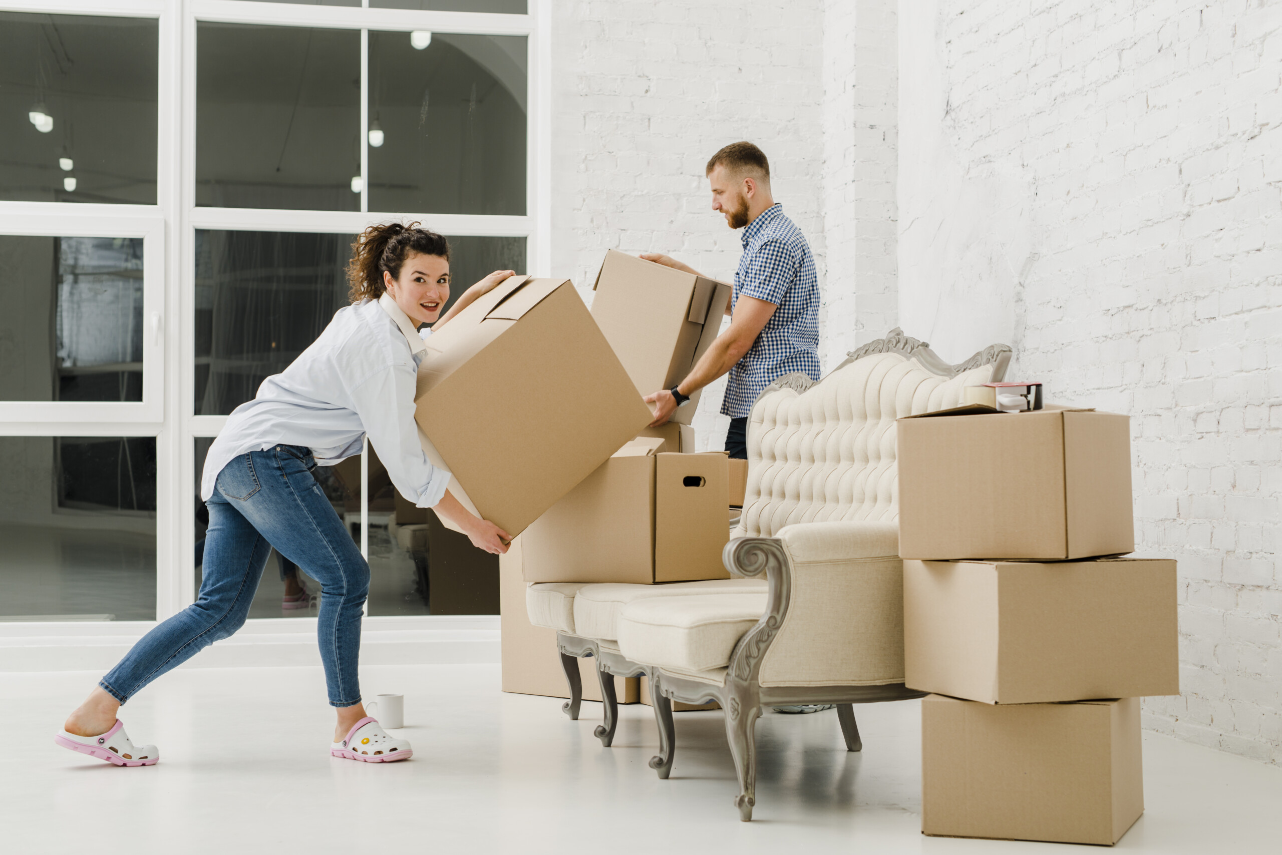 Couple Moving House Storage Boxes