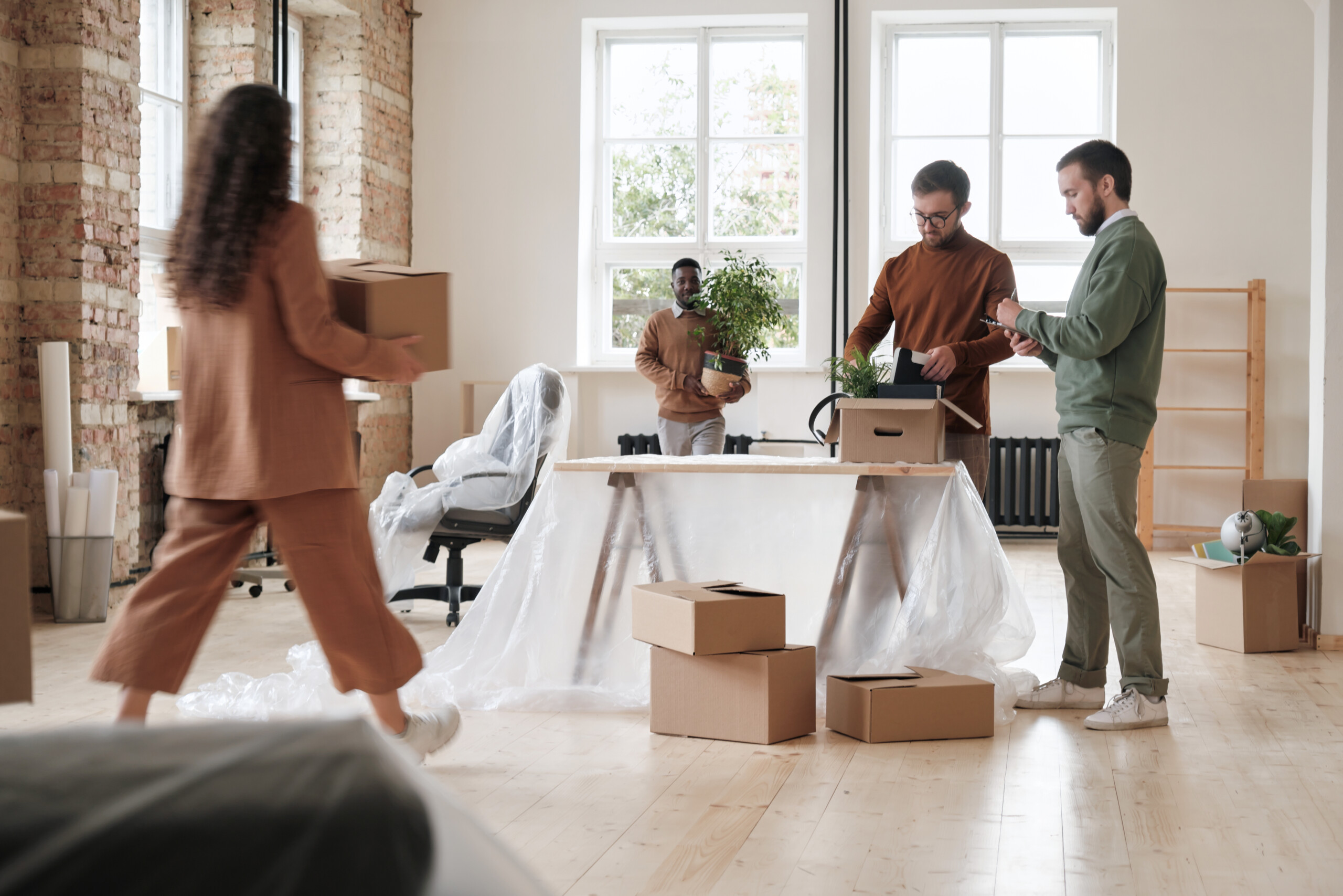Group of colleagues unpacking